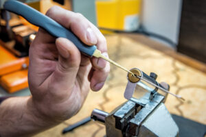 professional locksmith repairs door lock cylinder. Industrial theme